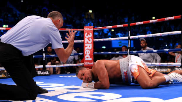       Joe Joyce lies on the floor following a punch from Zhilei Zhang during the WBO Interim World Heavyweight Title fight between Zhilei Zhang and Joe Joyce at OVO Arena Wembley on September 23, 2023 in London, England. STEPHEN POND/GETTY IMAGES. 